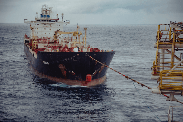 Offshore tanker KINCIS moored alongside a platform at sea
