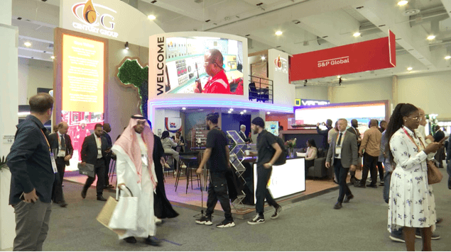 Busy exhibition floor with Century Group booth and attendees