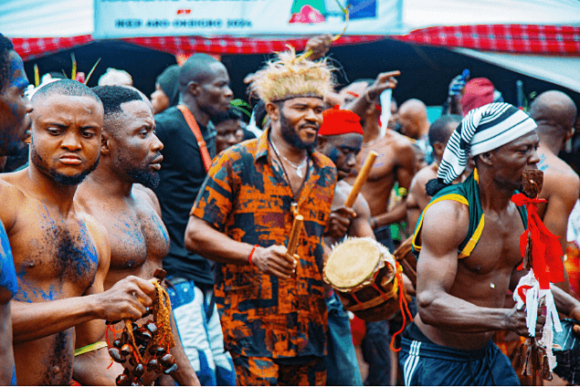 Close-up of procession musicians and ritual performers