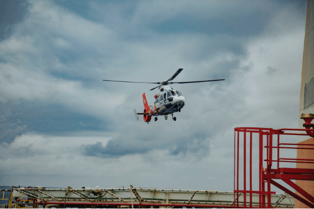 Helicopter approaching an offshore helideck