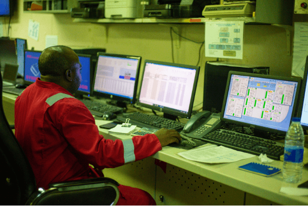 Control room operator monitoring offshore systems
