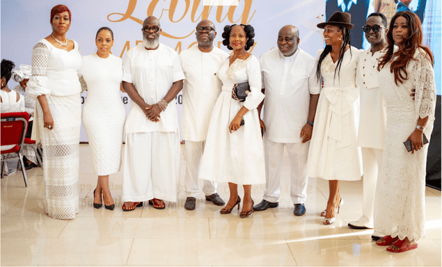 Group in white attire gathered in loving memory
